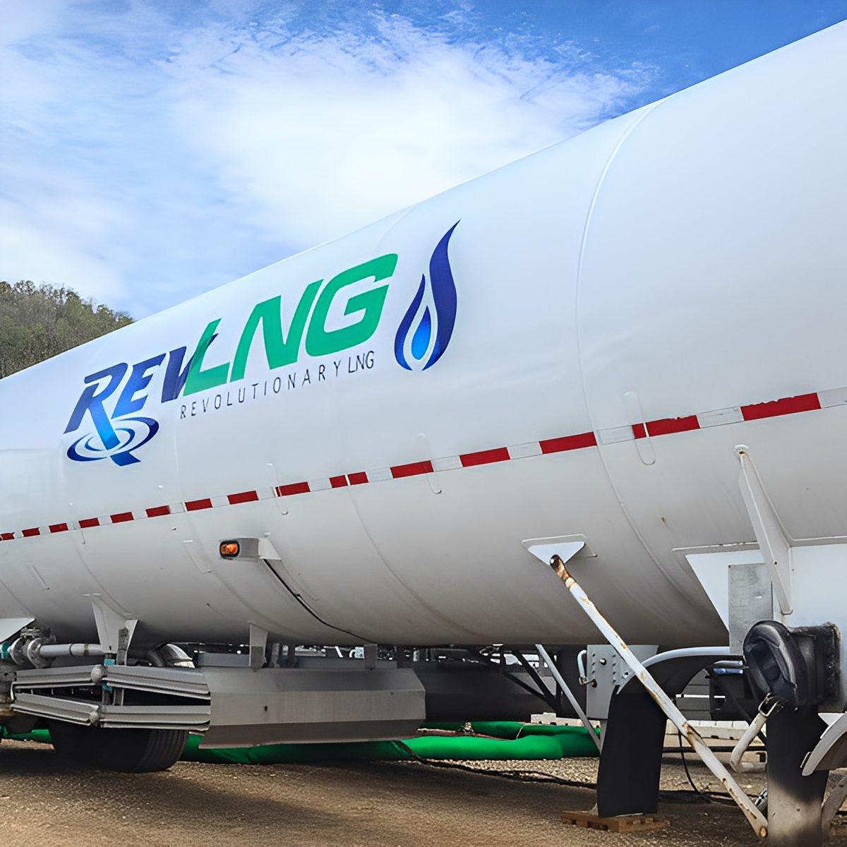 REV LNG tanker truck at night
